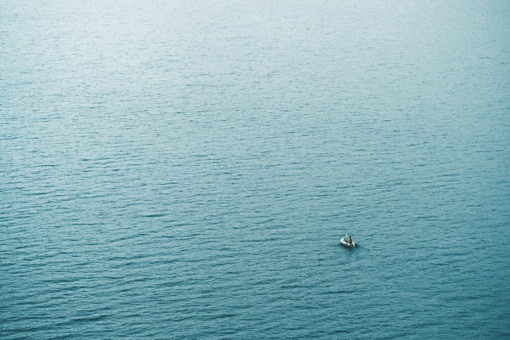 person in boat sailing at daytime